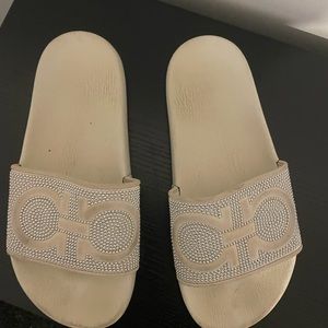 Salvatore Ferragamo white pool slides with silver studs, size 6.